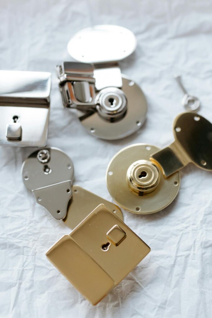 metal locks and a key on a textured surface, highlighting security.